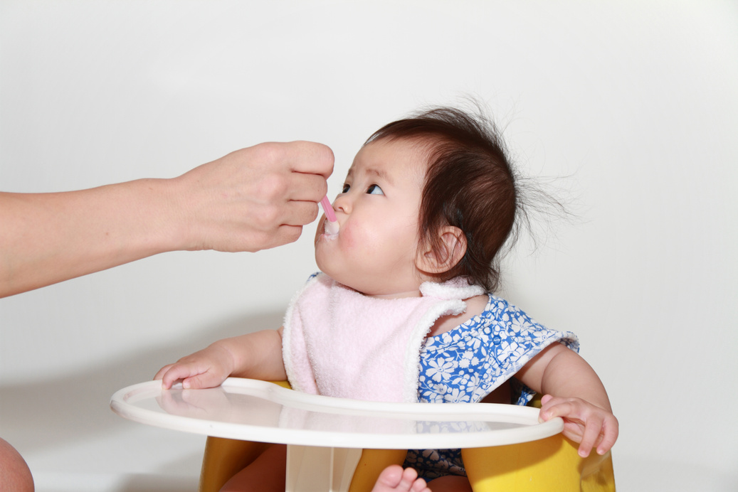Japanese baby girl eating baby food